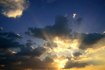 Scenic view dramatic beautiful sunset sky. Natural Sunset Sunrise on meadow silhouette shadow dark land. Vibrant dramatic sky on sunset, dawn, sunrise in Countryside. Landscape Colorful Sky At Sunset