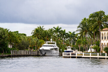 Luxury yacht docked by mansions in Fort Lauderdale FL