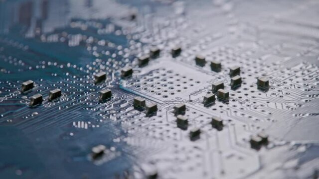 Computer electronic circuit board with radial conductor tracks and SMD capacitors rotating macro
