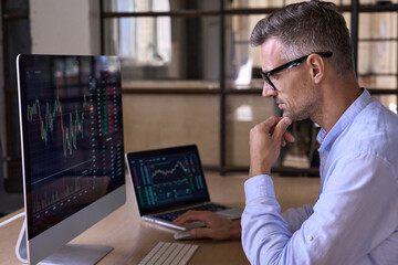 Crypto trader investor analyst broker using pc computer analyzing digital cryptocurrency exchange...