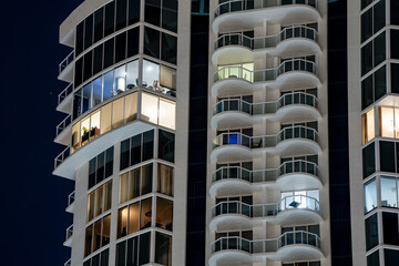 Fototapeta na wymiar Condominiums lit at night