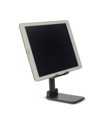 Tablet with blank screen on stand holder isolated on white background