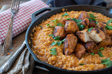 fried chicken breast with tomato, red lentil risotto