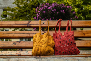Eco friendly cotton net bag for shoppingon a wooden bench. Zero waste concept.