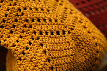 Eco friendly net yellow bag crocheted with a wavy pattern for shopping. Zero waste concept.