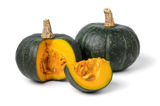 Fresh green whole Kabocha pumpkin and a cut close up isolated on white background 