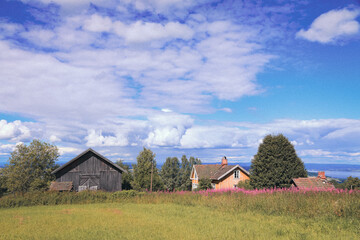 abandoned farm in the hills at summer