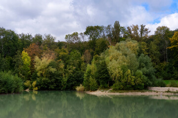 Fototapeta na wymiar The blue lake in the Carnelle forest. The Oise Regional Nature Park - Pays de France