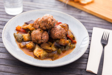 steamed meatballs with stewed vegetables with haze on plate