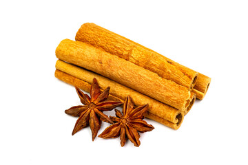 Pile of cinnamon stick and anise isolated on white background.