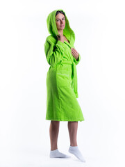 woman in a Bathrobe on an isolated white background with a smile on her face.