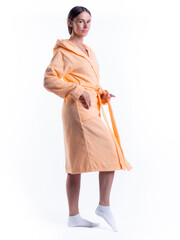 woman in a Bathrobe on an isolated white background with a smile on her face.