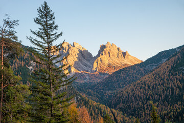 Magical nature in Dolomites at the national park Three Peaks (Tre Cime, Drei Zinnen) during sunset and golden Autumn, South Tyrol, Italy.