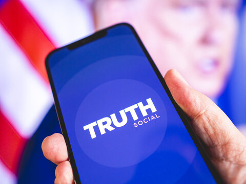 Truth Social - Social network launched by former President of the United States of America, Donald Trump - Micro blogging application, Twitter competitor - Logo mock-up on smartphone