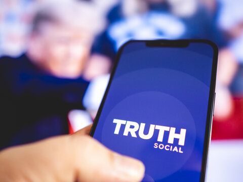 Truth Social - Social network launched by former President of the United States of America, Donald Trump - Micro blogging application, Twitter competitor - Logo mock-up on smartphone