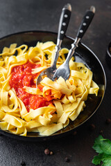 pasta tomato sauce tagliatelle ready to eat meal snack on the table copy space food background rustic. top view keto or paleo diet veggie vegan or vegetarian food no meat