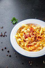 pasta tomato sauce tagliatelle ready to eat meal snack on the table copy space food background rustic. top view keto or paleo diet veggie vegan or vegetarian food no meat