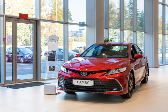 Minsk, Belarus - OCTOBER 28, 2021: new Toyota Camry red in the dealership showroom