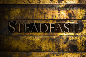 Steadfast text on textured grunge copper and vintage gold background
