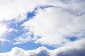 Naklejka na ściany i meble Natural abstract background - blue sky and white clouds.