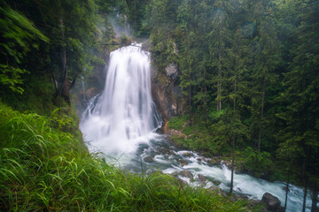 The Gollinger waterfall in Austria on rainy day