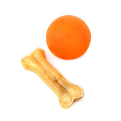 Ball and chewing bone - dog toys isolated on white .