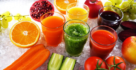 Fototapeta premium Glasses with fresh organic vegetable and fruit juices