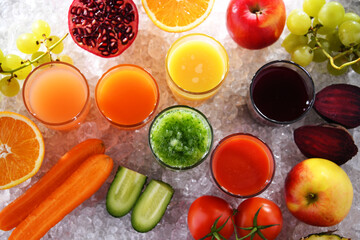 Glasses with fresh organic vegetable and fruit juices