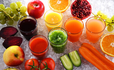 Glasses with fresh organic vegetable and fruit juices