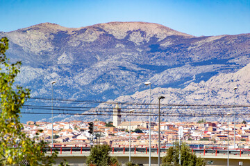 Views of Colmenar Viejo with the Sierra de Guadarrama in the background on a clear day in the Community of Madrid, Spain. Europe. Horizontal photography.