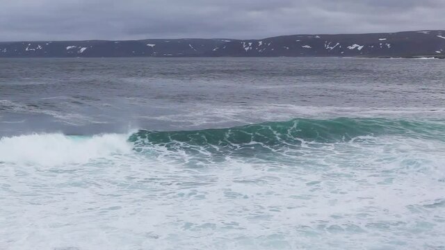 Heavy surf off the coast at the abandoned fishing harbour of Hamningberg, Finnmark, Norway