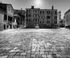 Black and white Venice. The sun-drenched square of the old town. Italy. Veneto. Venice.