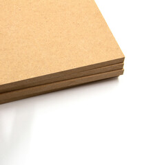 Three boards of raw MDF produced from chopped wood, ie residues (sawdust).