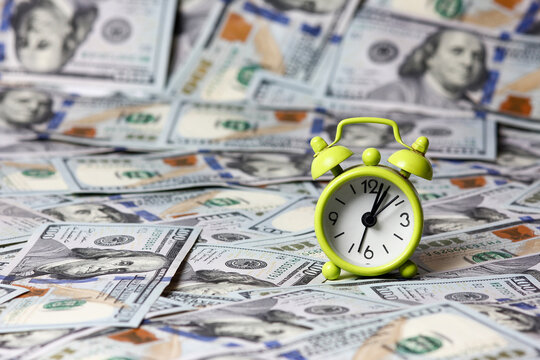 alarm clock and dollars time money
