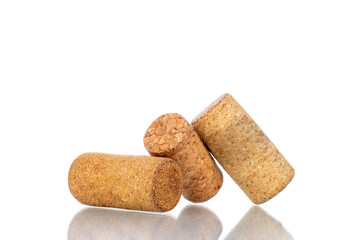 Three wine corks, close-up, isolated on white.