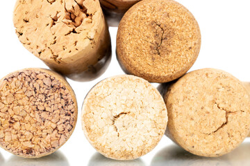 Several wine corks, close-up, isolated on white.