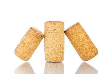 Three wine corks, close-up, isolated on white.