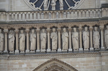 Paris, France - famous Notre Dame cathedral facade saint statues. UNESCO World Heritage Site