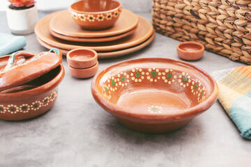 A view of a collection of Mexican clay dishware.