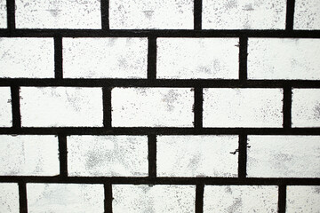 A view of a painted brick wall pattern, as a background.