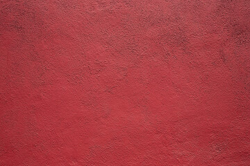 A view of a red stucco texture wall, as a background.