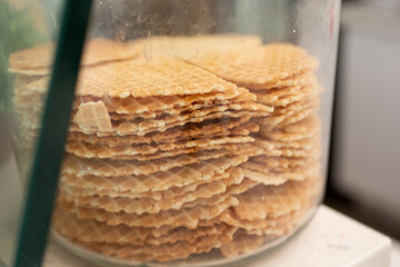 A view of a jar of waffle wafers, seen at a local dessert restaurant.