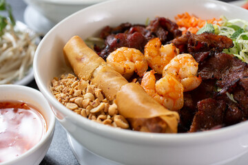 A closeup view of a bowl of Vietnamese vermicelli noodles known as Bún.