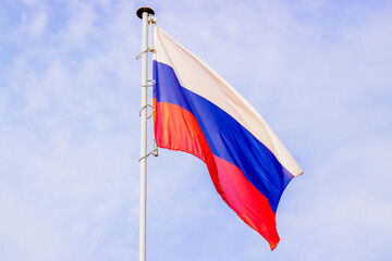 Fototapeta na wymiar National flag of Russia on a pole against against the sky