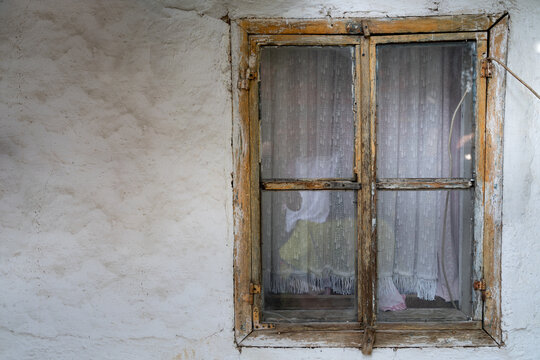 Old Wooden Window On An Old White House With Copy Space On The Left Side 