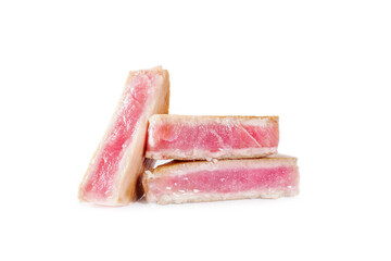 Rarely roasted tuna steaks close-up. Isolated on white background