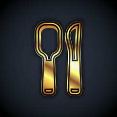 Gold Knife and spoon icon isolated on black background. Cooking utensil. Cutlery sign. Vector
