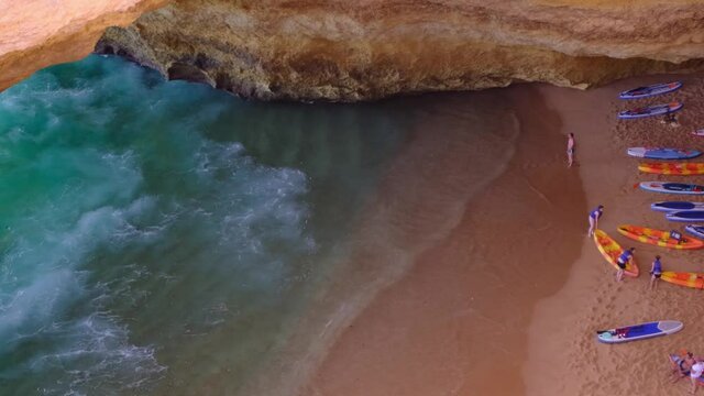 Benagil cave in Portugal, September 16, 2021 Carvoeiro Algarve, Lagos. Tourists swimming on paddle boards 