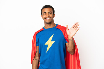 African American Super Hero man over isolated white background saluting with hand with happy expression © luismolinero