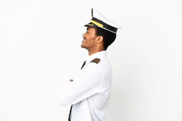 African American Airplane pilot over isolated white background in lateral position